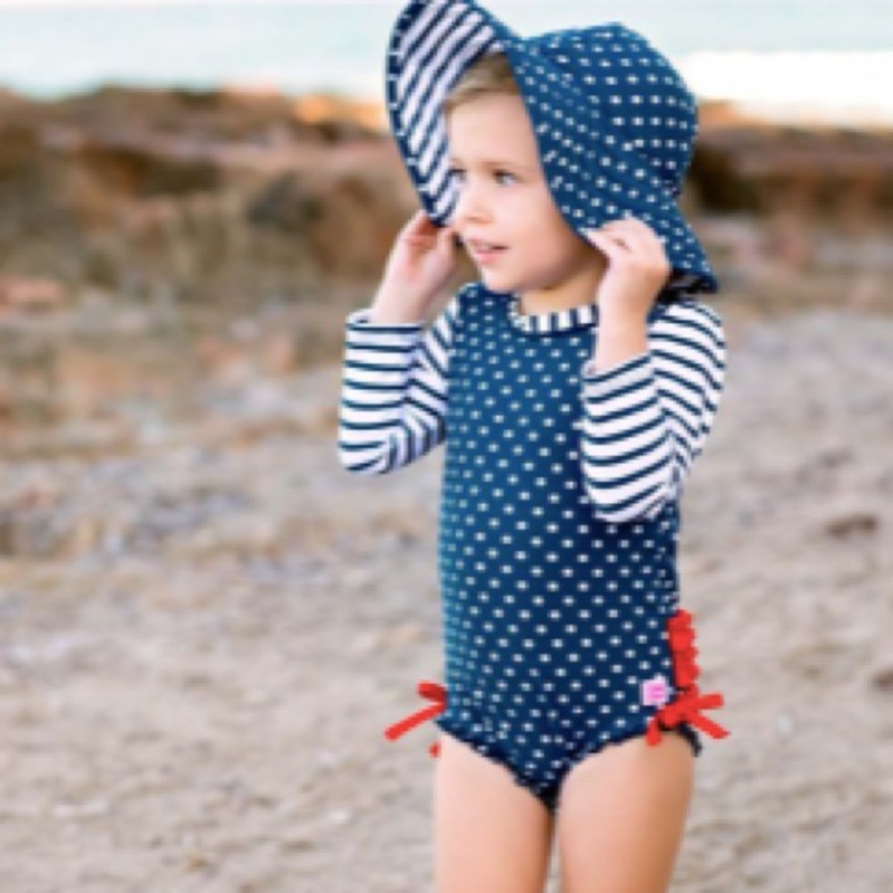 Ruffle Butt Navy One Piece Rash Guard + Hat